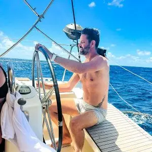 Passenger at the Helm on a Caribbean Private Sailboat Vacation