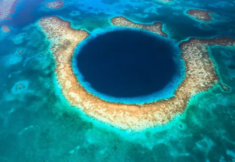 Arial shot of the great blue hole as part of a Belize sailing adventure